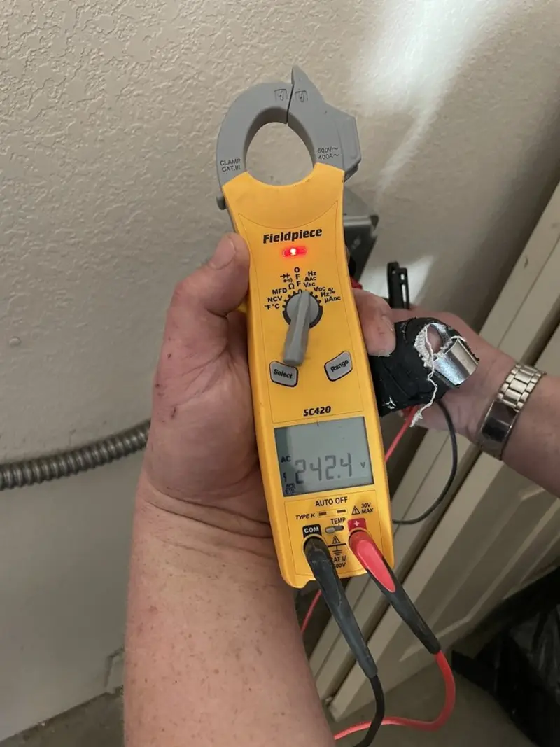 Voltage testing with clamp meter during Whole House Surge Protector in Dowagiac